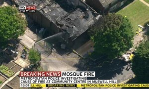 Firefighters attempt to control the blaze at an Islamic centre in north London