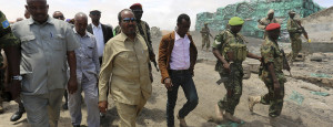 12 Oct 2014, Somalia --- Somalia's President Hassan Sheikh Mohamud (2nd R) arrives with his delegation in Barawe, a port town recaptured from the militant al Shabaab insurgents, south of the capital Mogadishu, October 12, 2014. Mohamud said on Saturday he would halt charcoal exports from Barawe, where U.N. investigators said the al Qaeda-affiliated insurgents had benefitted from the illegal trade. REUTERS/Feisal Omar (SOMALIA - Tags: CIVIL UNREST POLITICS CONFLICT) --- Image by © FEISAL OMAR/Reuters/Corbis